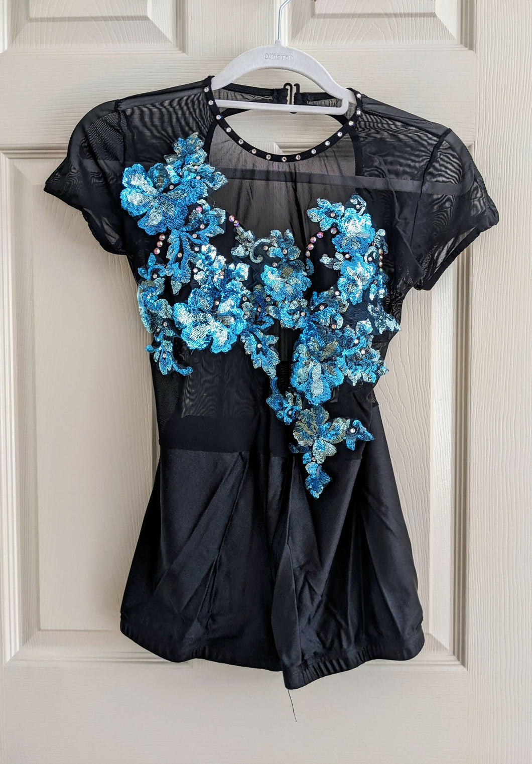 Black costume with blue sequin flowers
