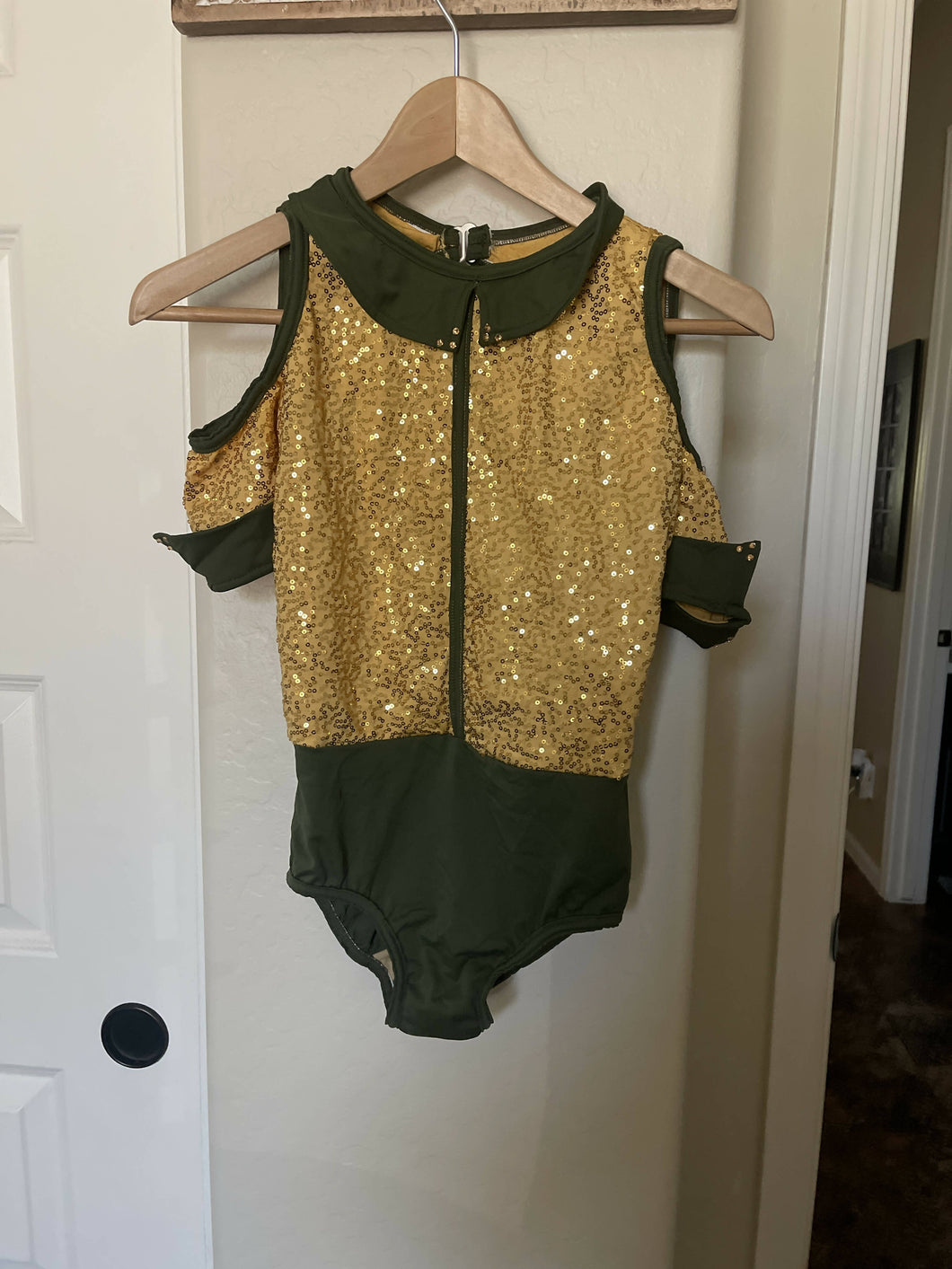Gold and green leotard and skit